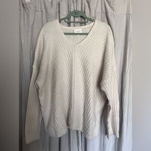 Elegant Cream V-Neck Sweater by [Brand]